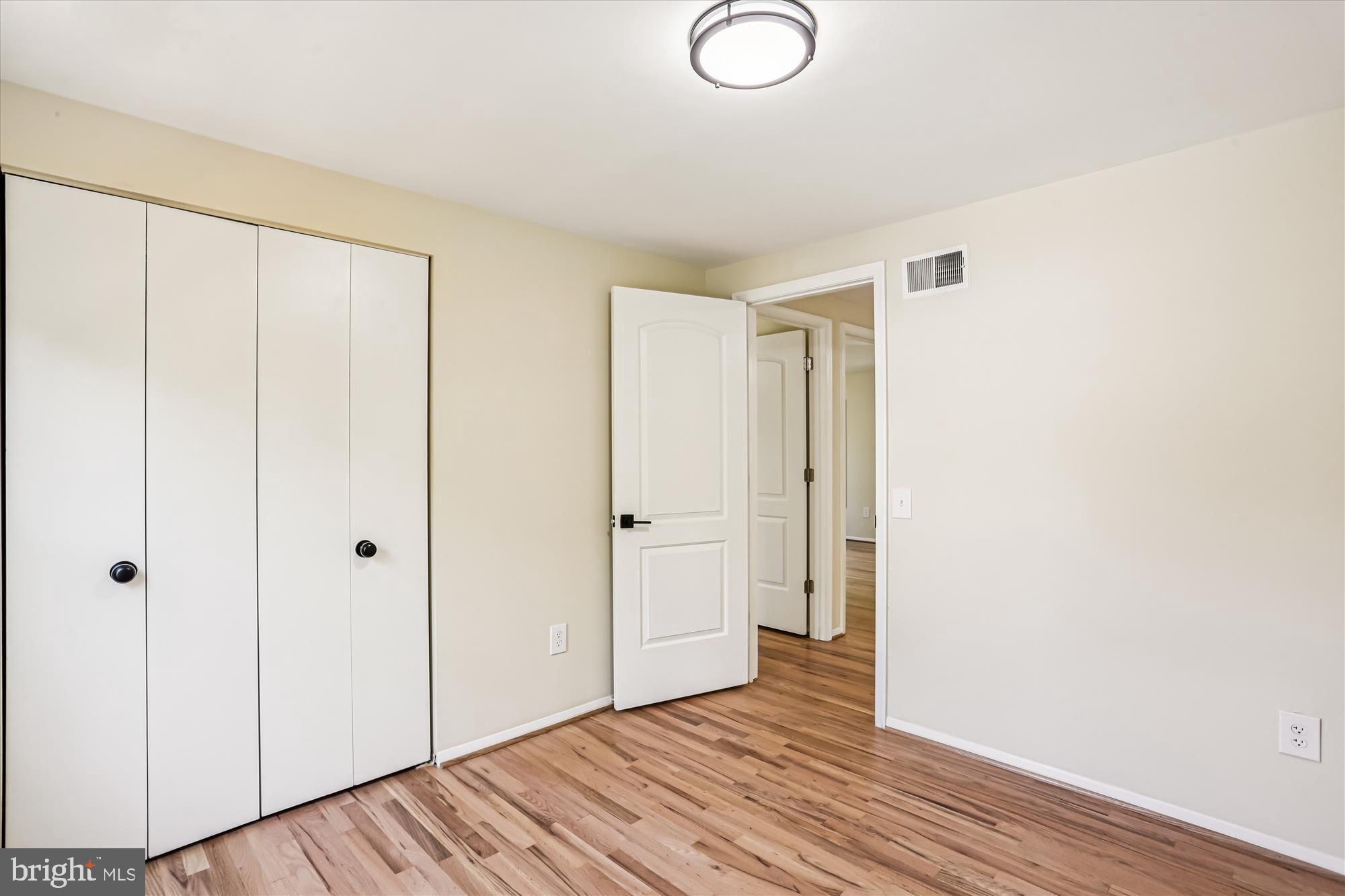 9017 Falls Chapel Way Potomac, MD 20854 - Photo 56 of 70 a view of a room with wooden floor