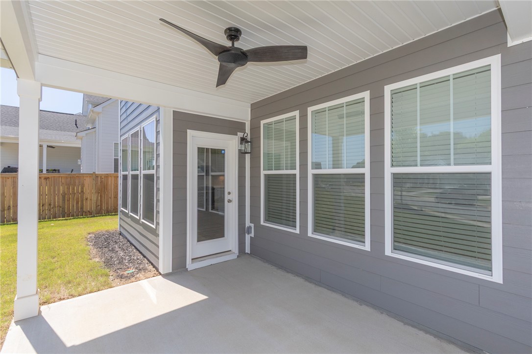 607 WH Kay Lane Anderson, SC 29621 - Photo 40 of 48 A breezy covered patio offers seamless outdoor living, perfect for relaxation and entertaining.