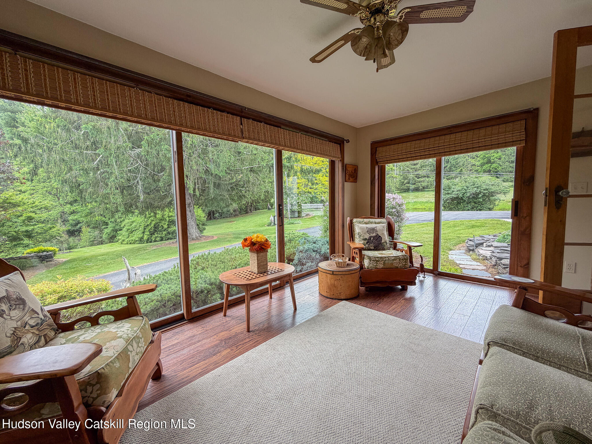 221 Camp Medusa Road Rensselaerville, NY 12120 - Photo 3 of 57 a living room with furniture and a floor to ceiling window