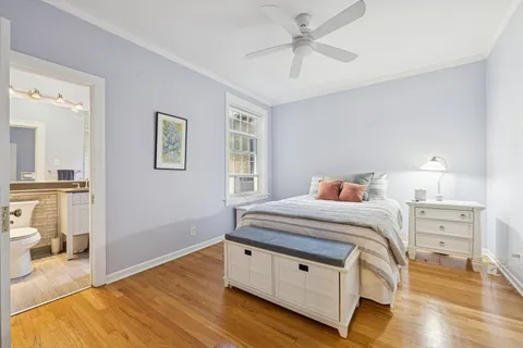 a bedroom with a bed and a view of bedroom