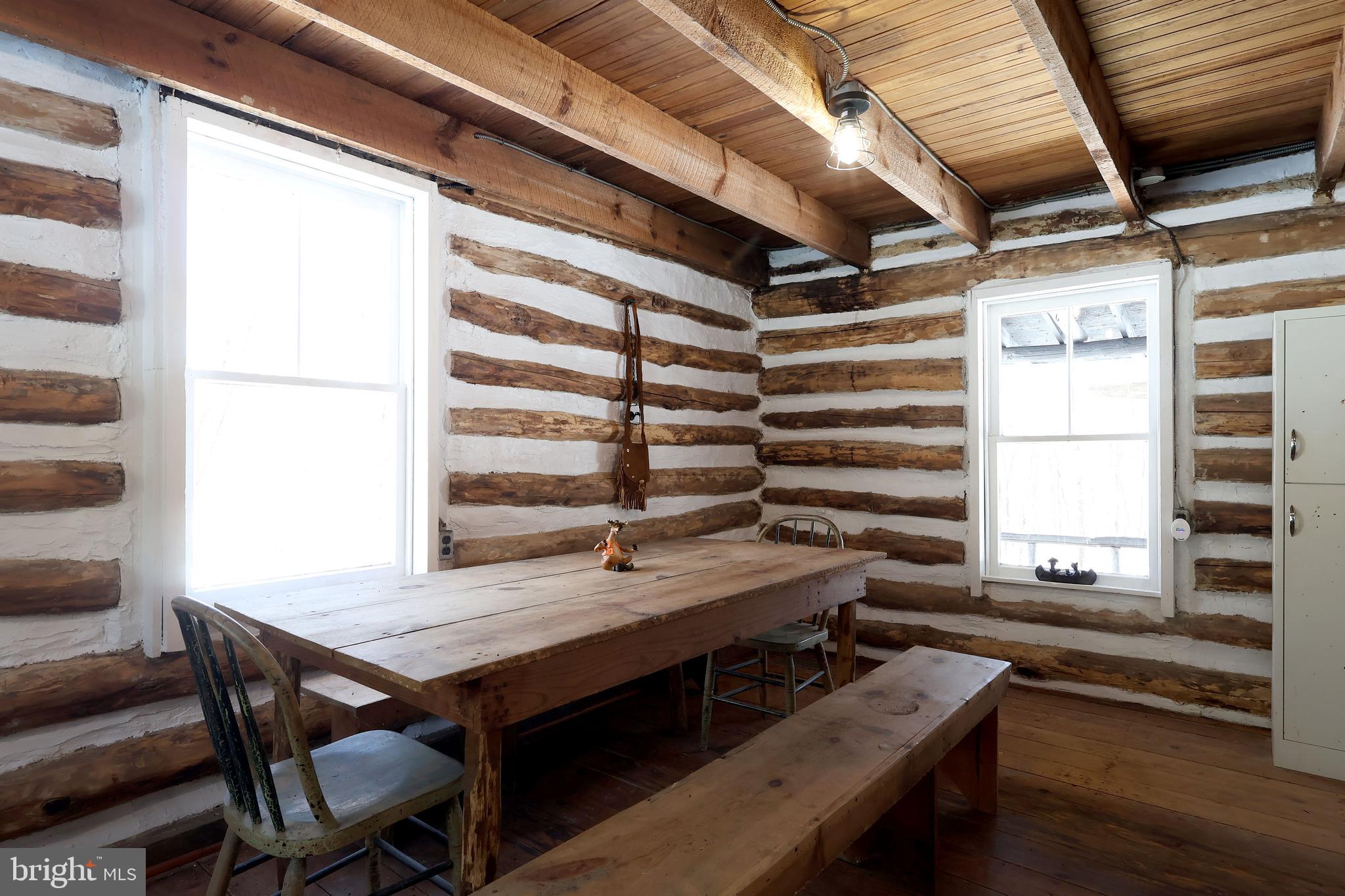 4464 Tram Road Spruce Creek, PA 16683 - Photo 17 of 53 a view of a room with a wooden table and chairs