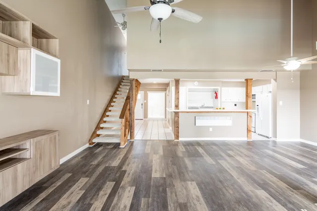 a view of kitchen with cabinets and wooden floor