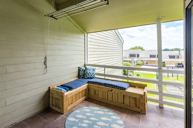 a room with window and a table chair
