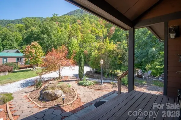 a wooden bench sitting in front of a house