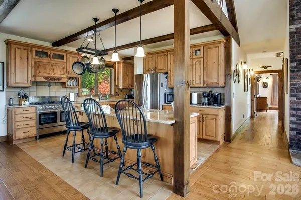 a view of a kitchen with furniture and a window