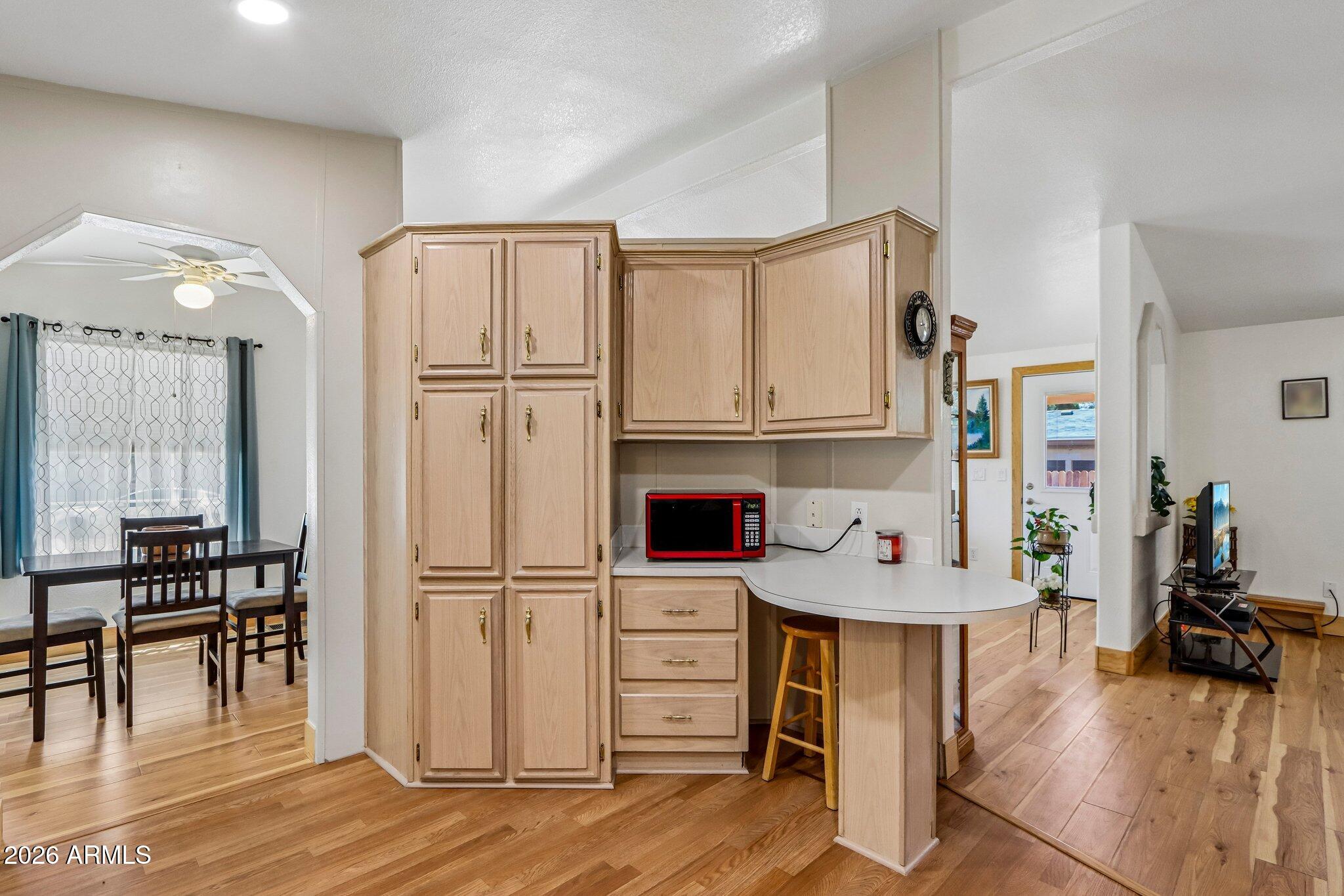 114 South Pinecrest Road Payson, AZ 85541 - Photo 13 of 40 a view of a kitchen with furniture and wooden floor