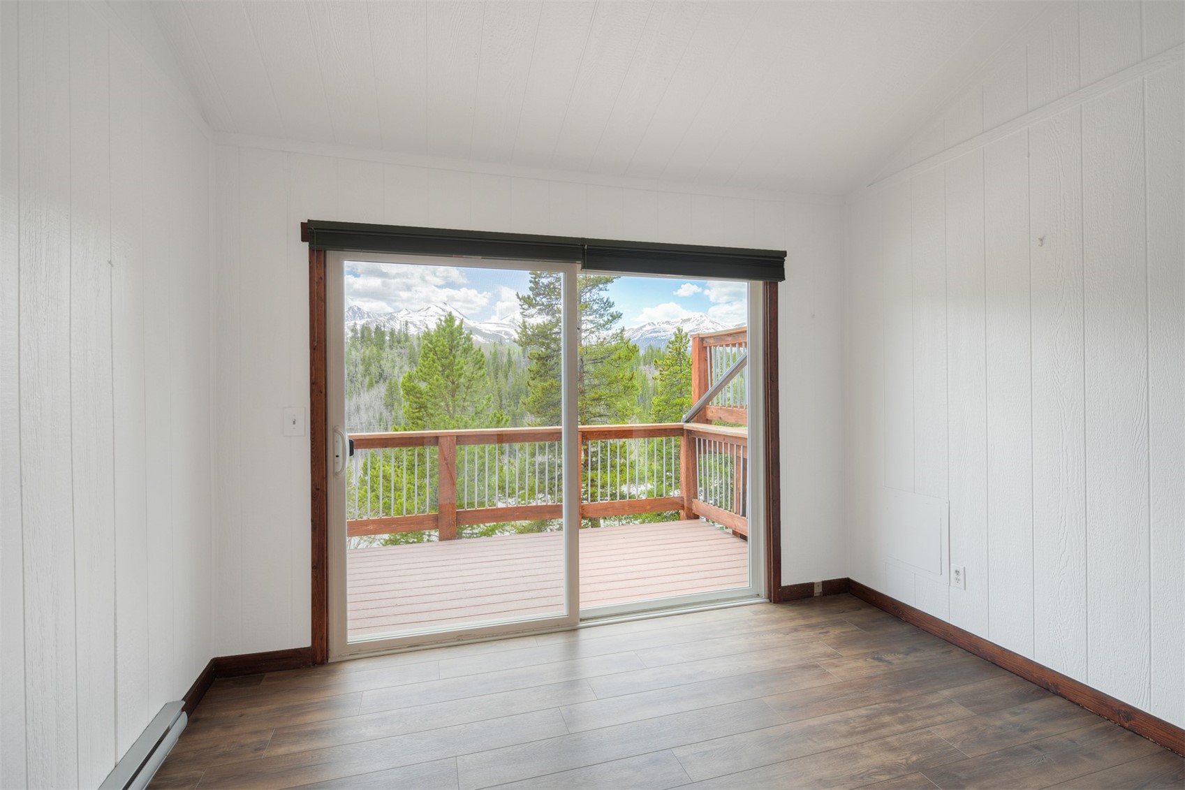 132 Illinois Gulch Road, Unit 3 Breckenridge, CO 80424 - Photo 14 of 32 a view of an empty room with wooden floor and a window