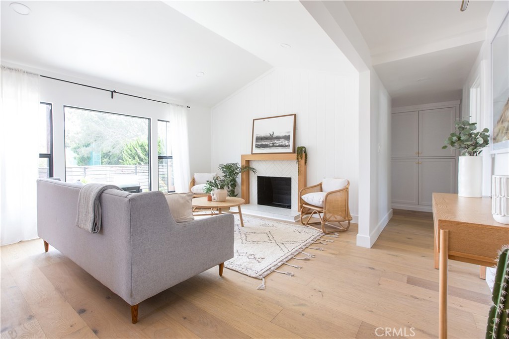 2372 Dewey Street Santa Monica, CA 90405 - Photo 3 of 22 a living room with furniture a large window and a fireplace