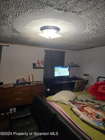 a room with furniture and a flat screen tv