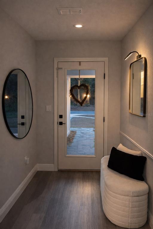 39 Redwood Track Run Ocala, FL 34472 - Photo 3 of 5 a room with wooden floor and mirror