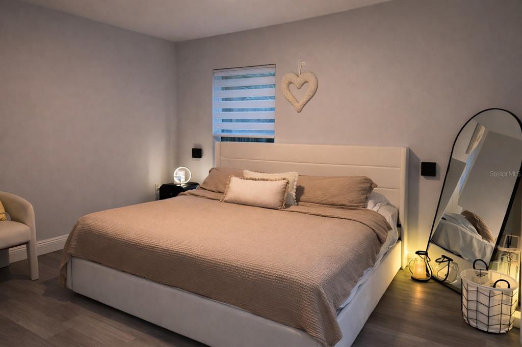 39 Redwood Track Run Ocala, FL 34472 - Photo 5 of 5 a bedroom with a bed and wooden floor