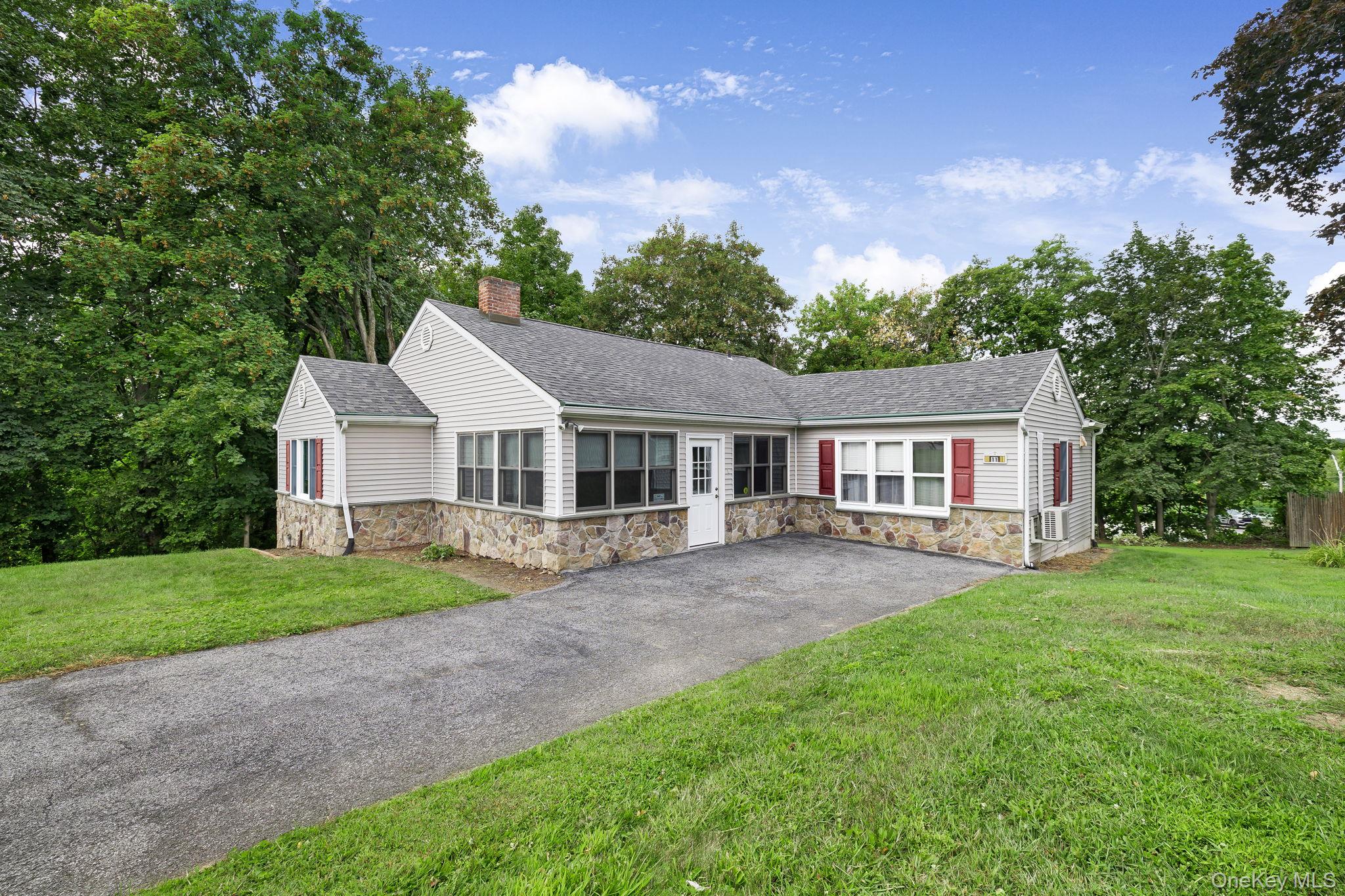 11 Mountainview Road Poughkeepsie, NY 12603 - Photo 1 of 1 Single story home with stone siding, roof with shingles, a front lawn, a chimney, and a patio