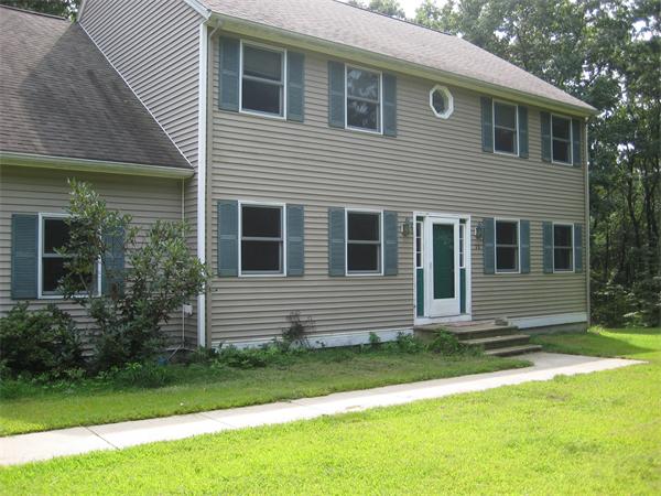 71 Spectacle Hill Road Bolton, MA 01740 - Photo 1 of 20 a view of a house with a yard