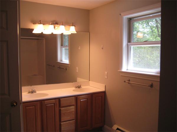 71 Spectacle Hill Road Bolton, MA 01740 - Photo 17 of 20 a bathroom with a sink and a mirror