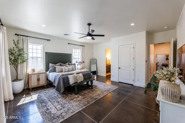 a bed room with a bed and a couch