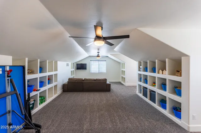 a view of a living room and a floor to ceiling window