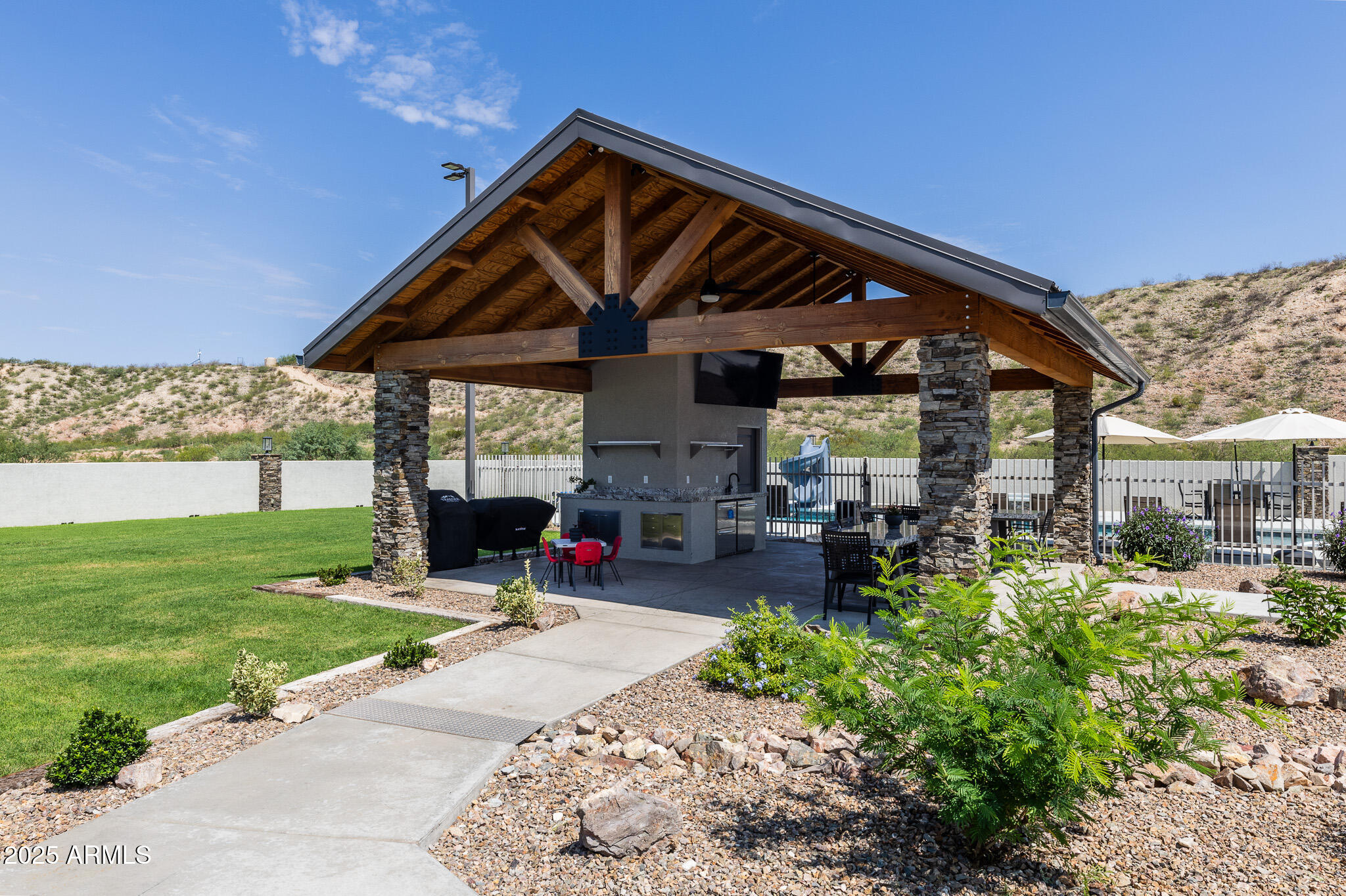 1778 East Ramsey Road Benson, AZ 85602 - Photo 36 of 50 a view of a house with yard and sitting area