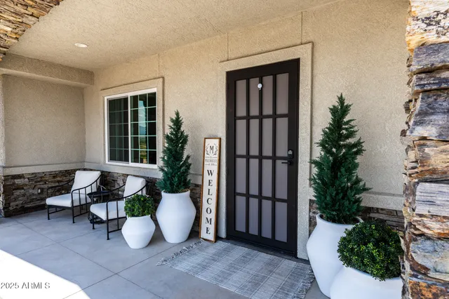 a view of a house with outdoor seating space