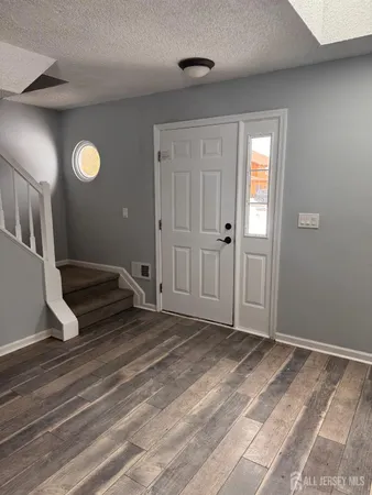 a view of livingroom with furniture and wooden floor