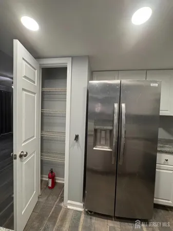 a bathroom with a shower and a sink