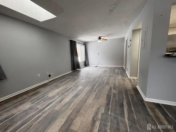 a view of wooden floor in an empty room