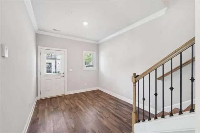 a view of an entryway with wooden floor