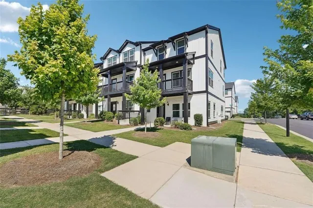 a view of a building with a yard