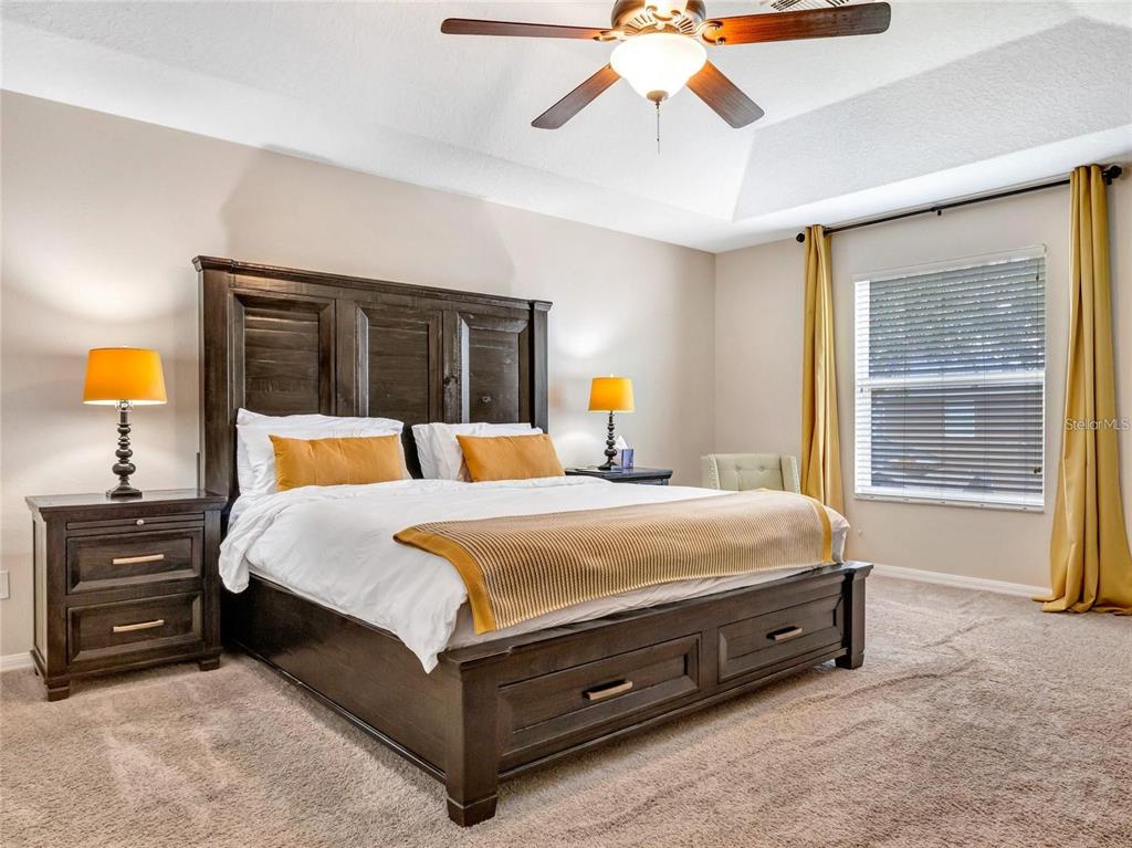 10023 Ians Ridge Road Orlando, FL 32832 - Photo 26 of 60 a bedroom with a bed and window