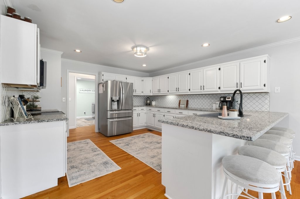 3597 McMahan Road Morrison, TN 37357 - Photo 13 of 45 a kitchen with stainless steel appliances granite countertop a sink stove and refrigerator