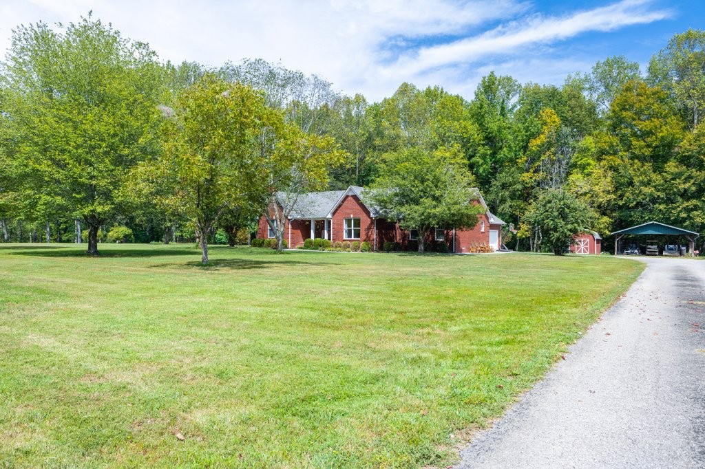 3597 McMahan Road Morrison, TN 37357 - Photo 2 of 45 a view of a house with a big yard