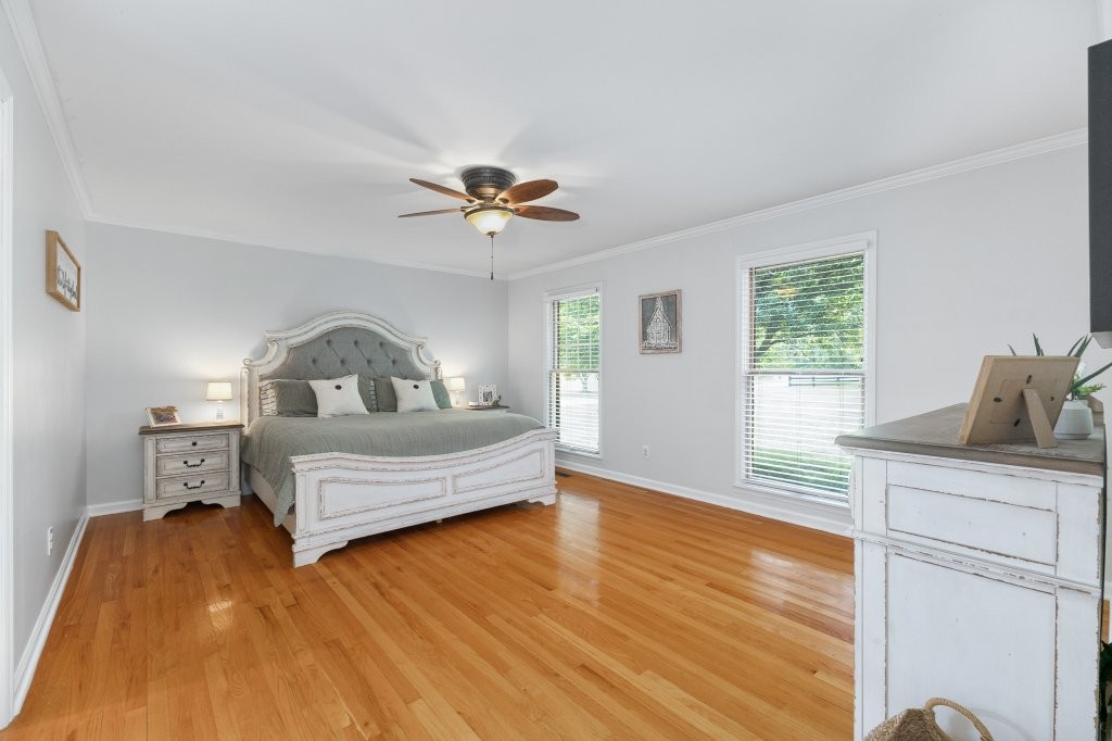 3597 McMahan Road Morrison, TN 37357 - Photo 24 of 45 a bedroom with a bed and wooden floor