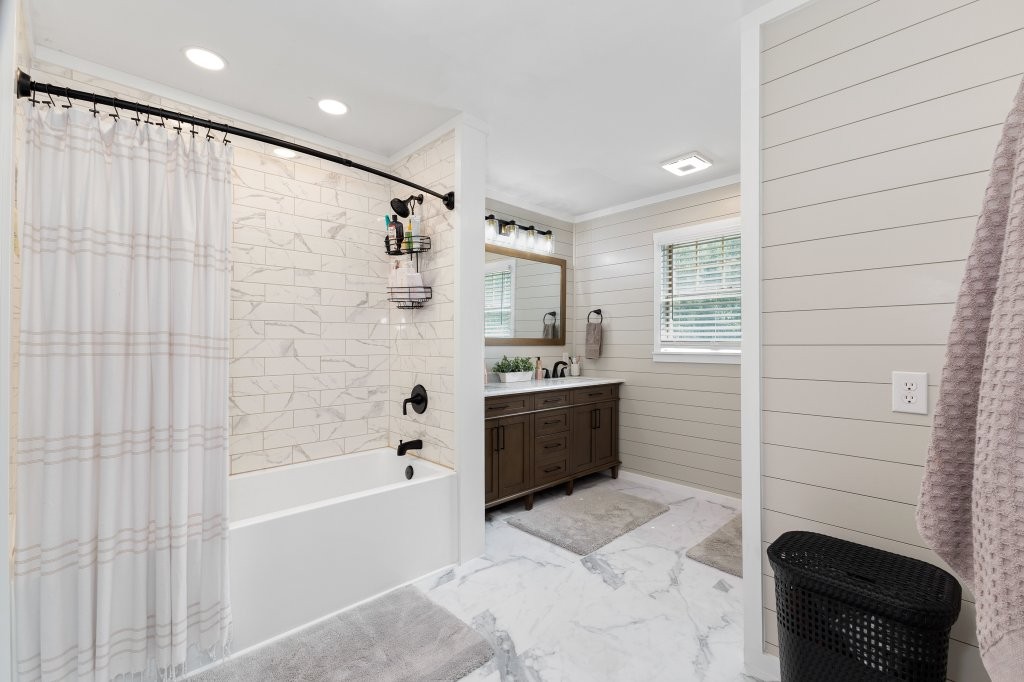 3597 McMahan Road Morrison, TN 37357 - Photo 26 of 45 a bathroom with a bathtub and a shower