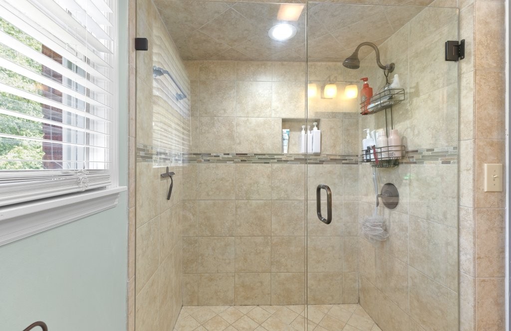 3597 McMahan Road Morrison, TN 37357 - Photo 29 of 45 a bathroom with a glass shower door