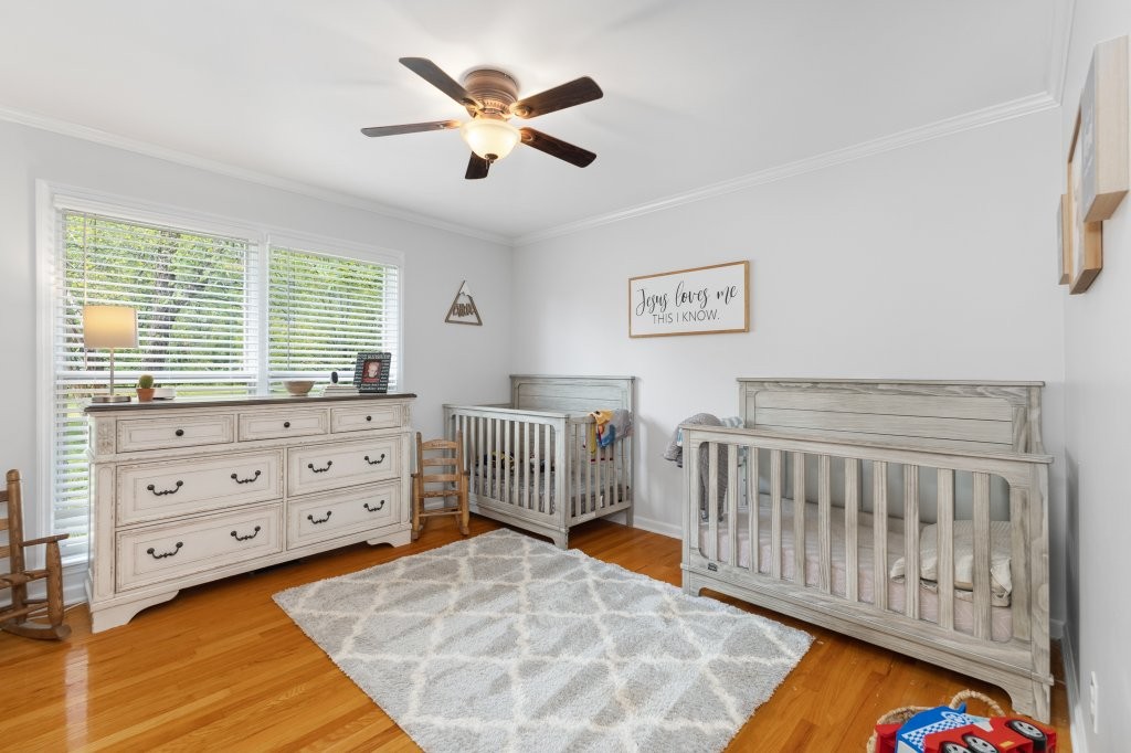 3597 McMahan Road Morrison, TN 37357 - Photo 30 of 45 a bedroom with a bed and a dresser in it