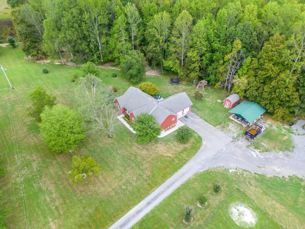 3597 McMahan Road Morrison, TN 37357 - Photo 33 of 45 a view of a table and chairs in backyard