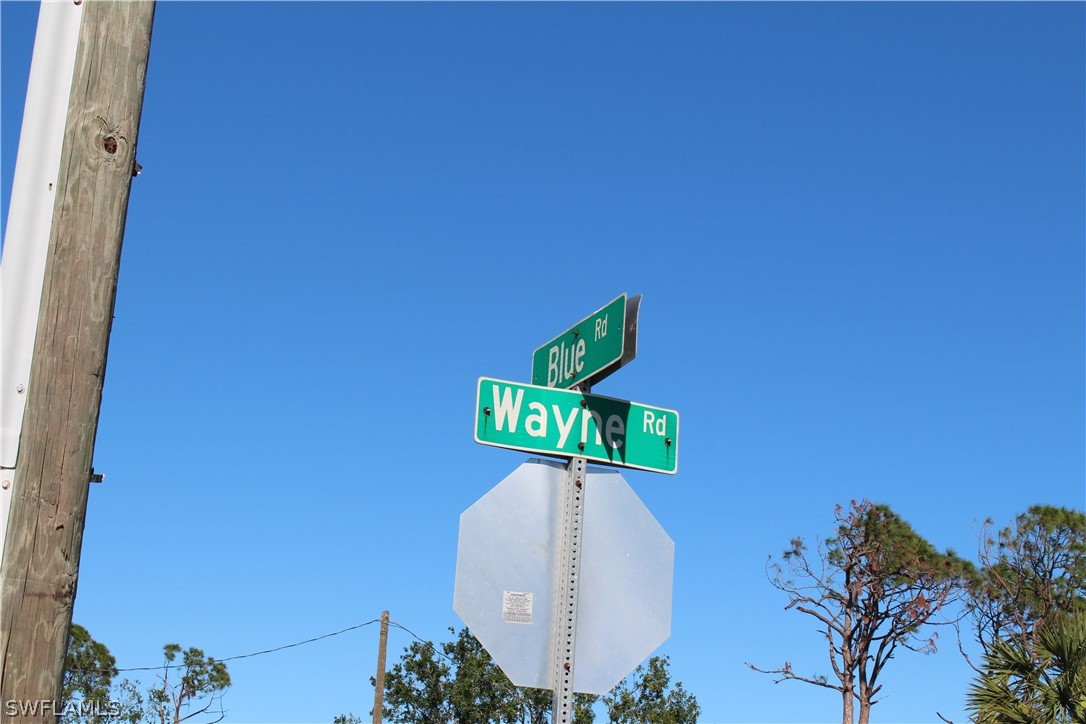 119 Blue Road Rotonda West, FL 33947 - Photo 3 of 6 a sign that is on the wall of a building