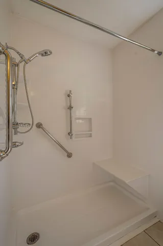 a bathroom with a shower and a shower head