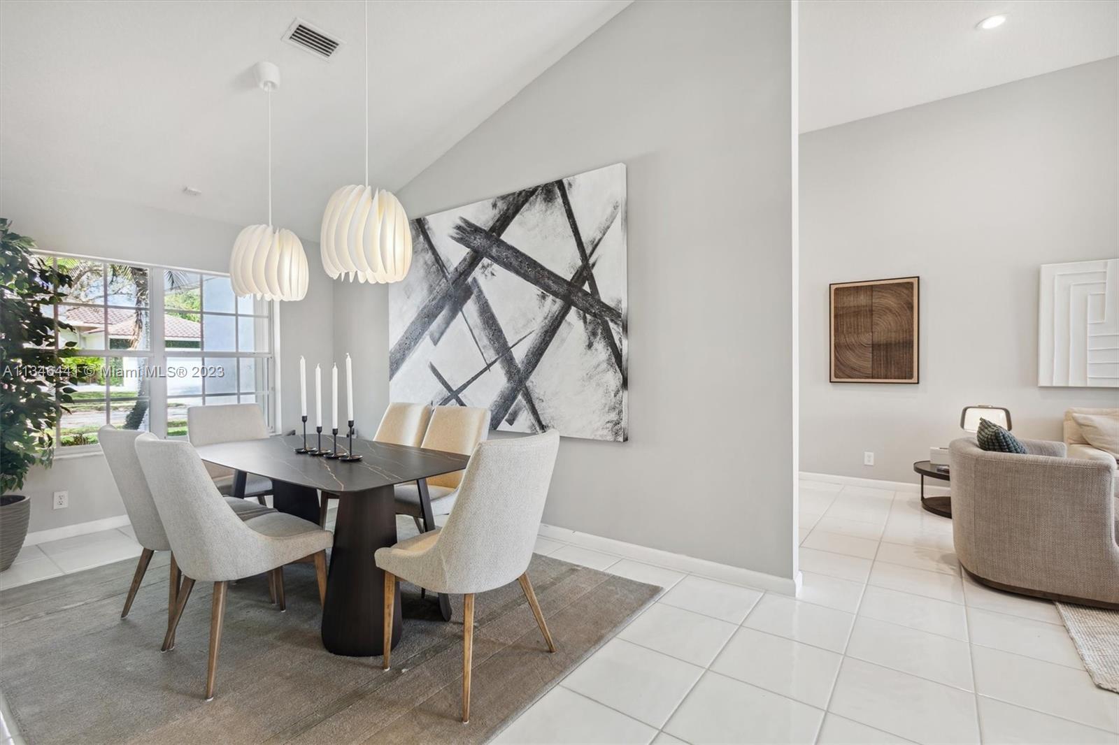 2883 Oakbrook Drive Weston, FL 33332 - Photo 16 of 74 a view of a dining room with furniture