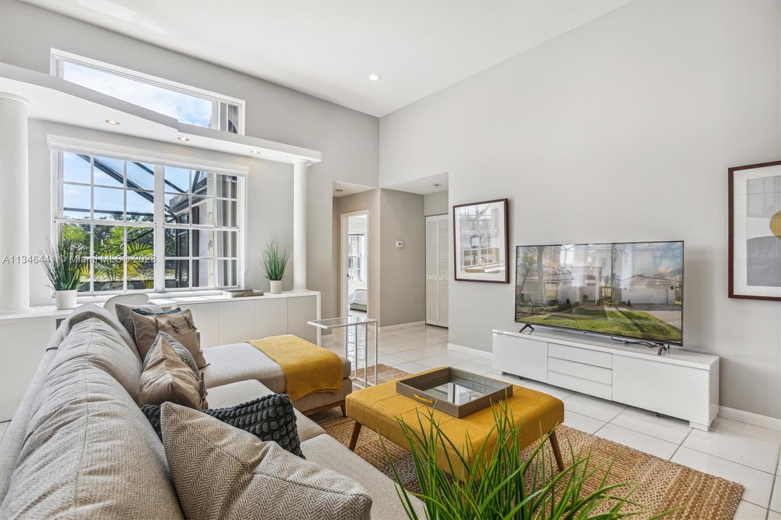 2883 Oakbrook Drive Weston, FL 33332 - Photo 21 of 74 a living room with furniture and a flat screen tv