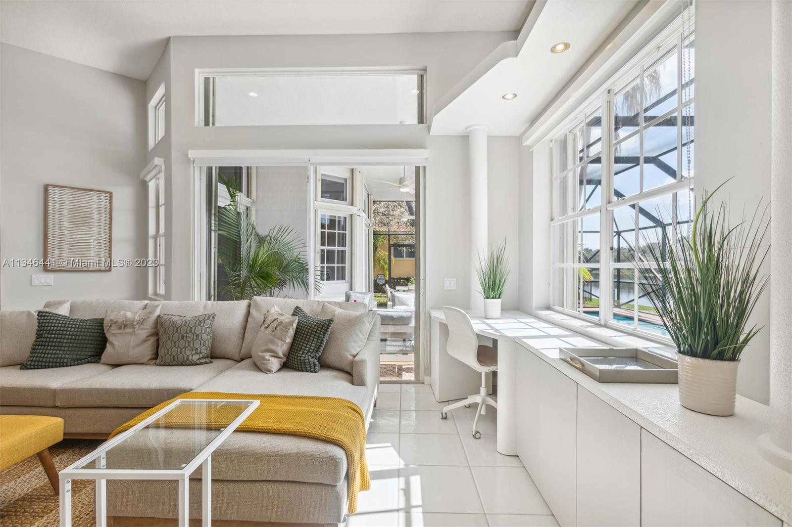 2883 Oakbrook Drive Weston, FL 33332 - Photo 23 of 74 a living room with a couch and a potted plant