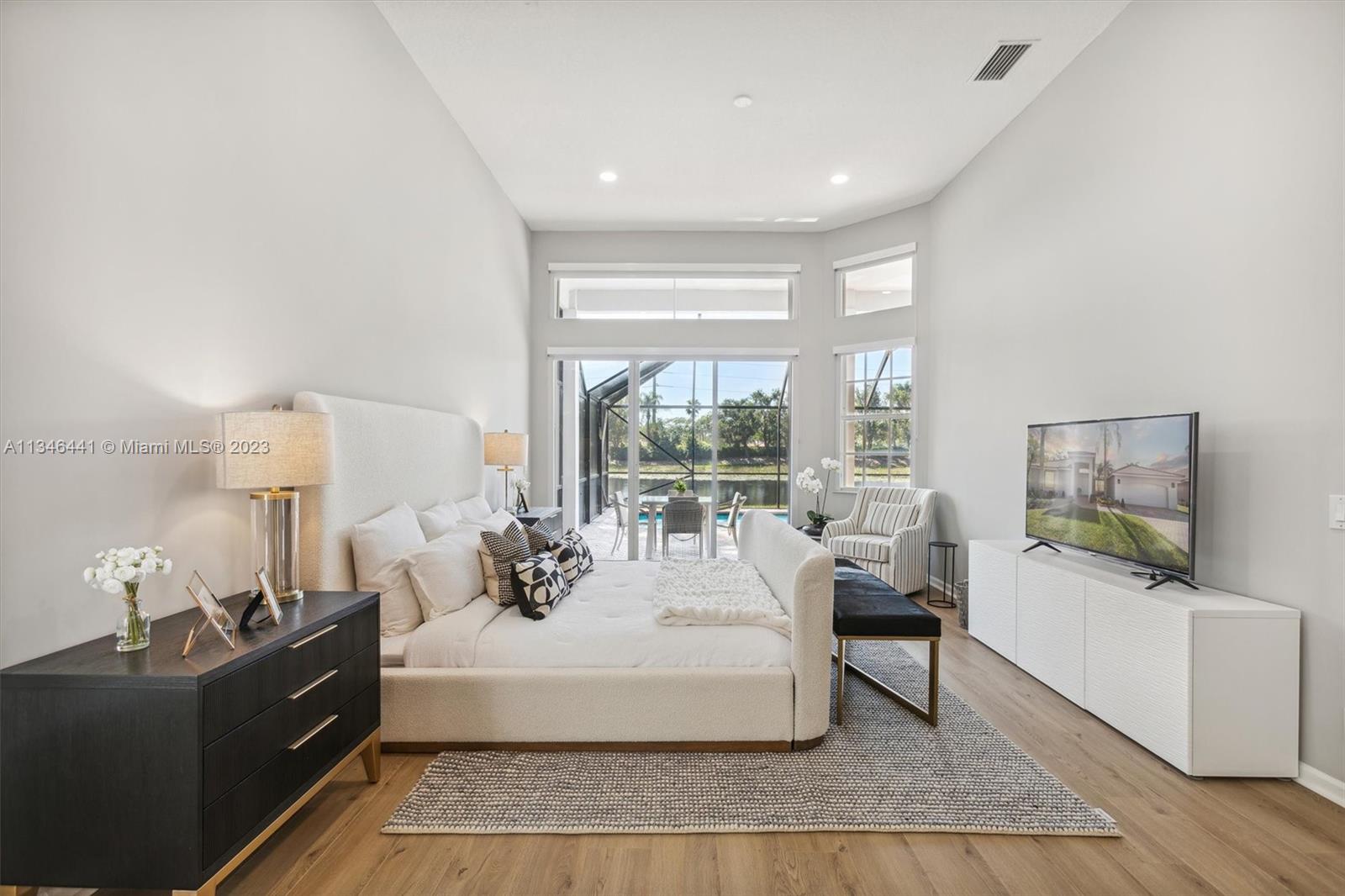 2883 Oakbrook Drive Weston, FL 33332 - Photo 28 of 74 a living room with furniture and a flat screen tv