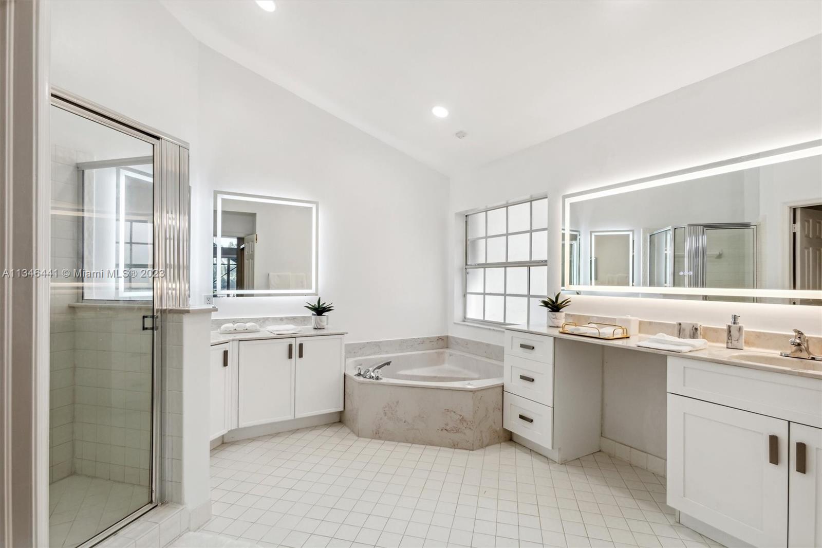 2883 Oakbrook Drive Weston, FL 33332 - Photo 31 of 74 a large white kitchen with a sink and cabinets