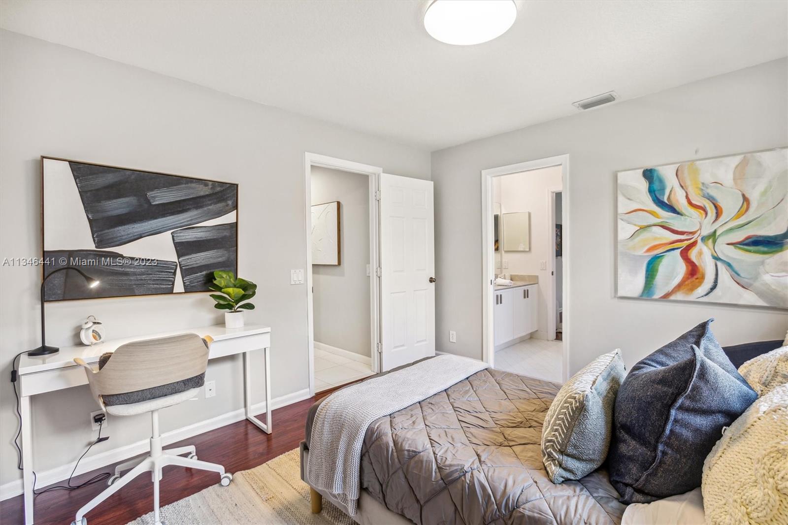 2883 Oakbrook Drive Weston, FL 33332 - Photo 35 of 74 a bedroom with a bed and a chair