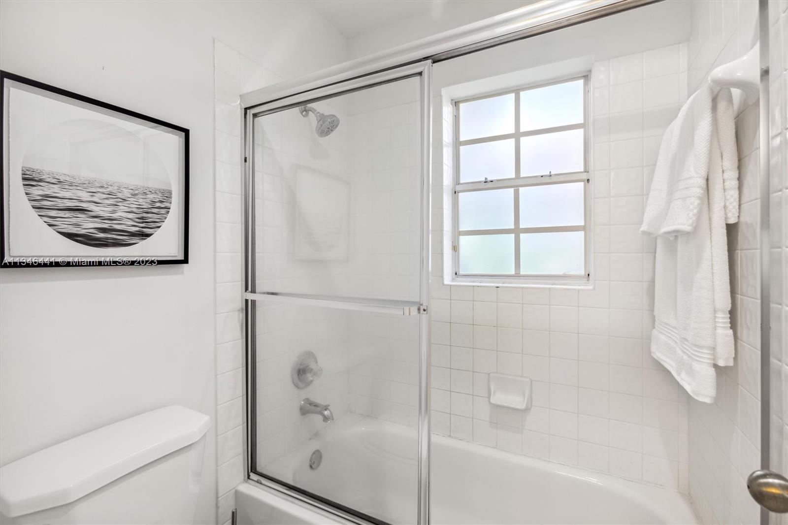 2883 Oakbrook Drive Weston, FL 33332 - Photo 37 of 74 a bathroom with a shower and a toilet