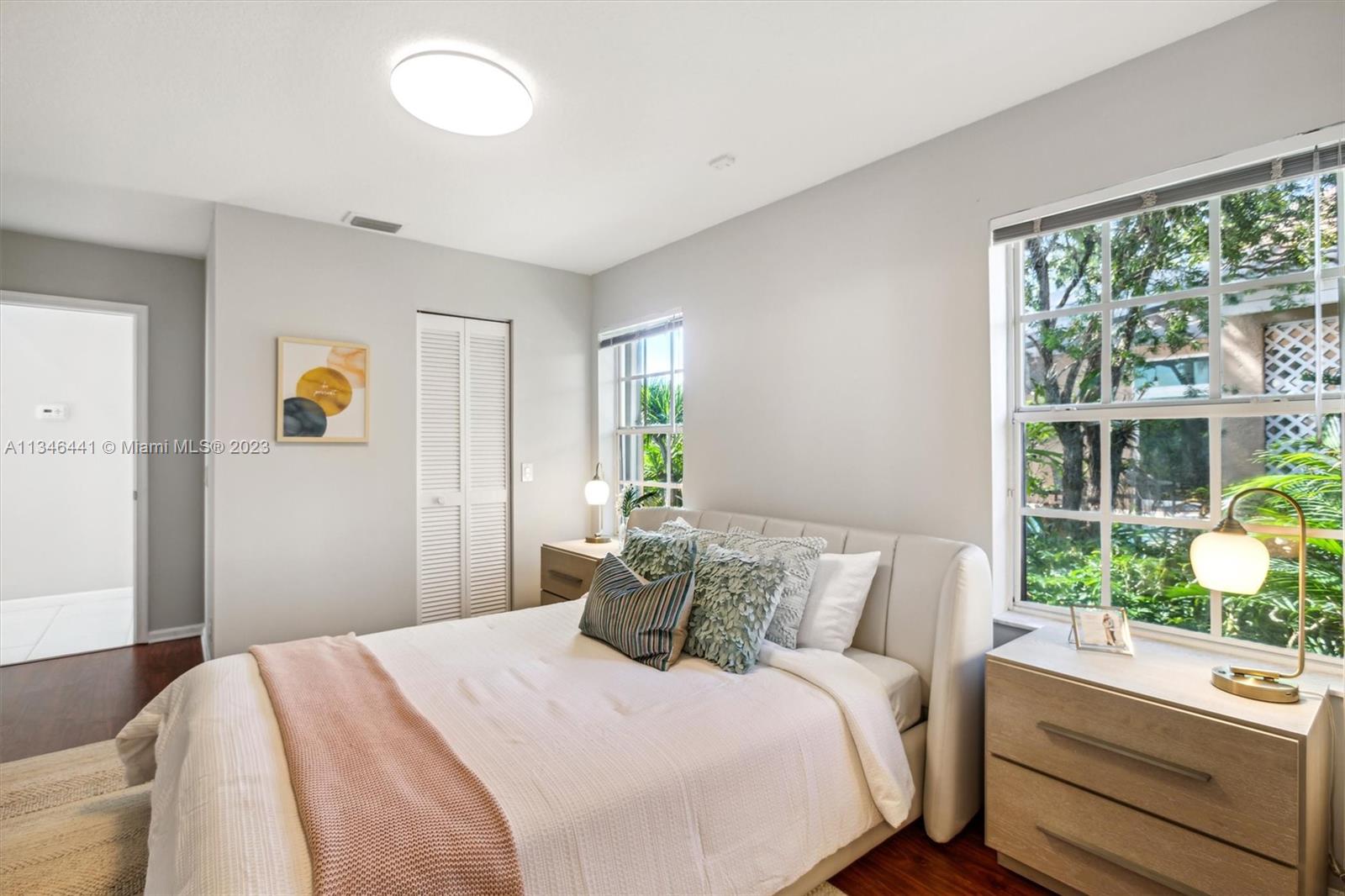 2883 Oakbrook Drive Weston, FL 33332 - Photo 38 of 74 a bedroom with a bed and a window