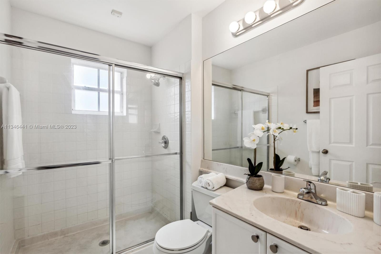 2883 Oakbrook Drive Weston, FL 33332 - Photo 42 of 74 a bathroom with a sink toilet and shower