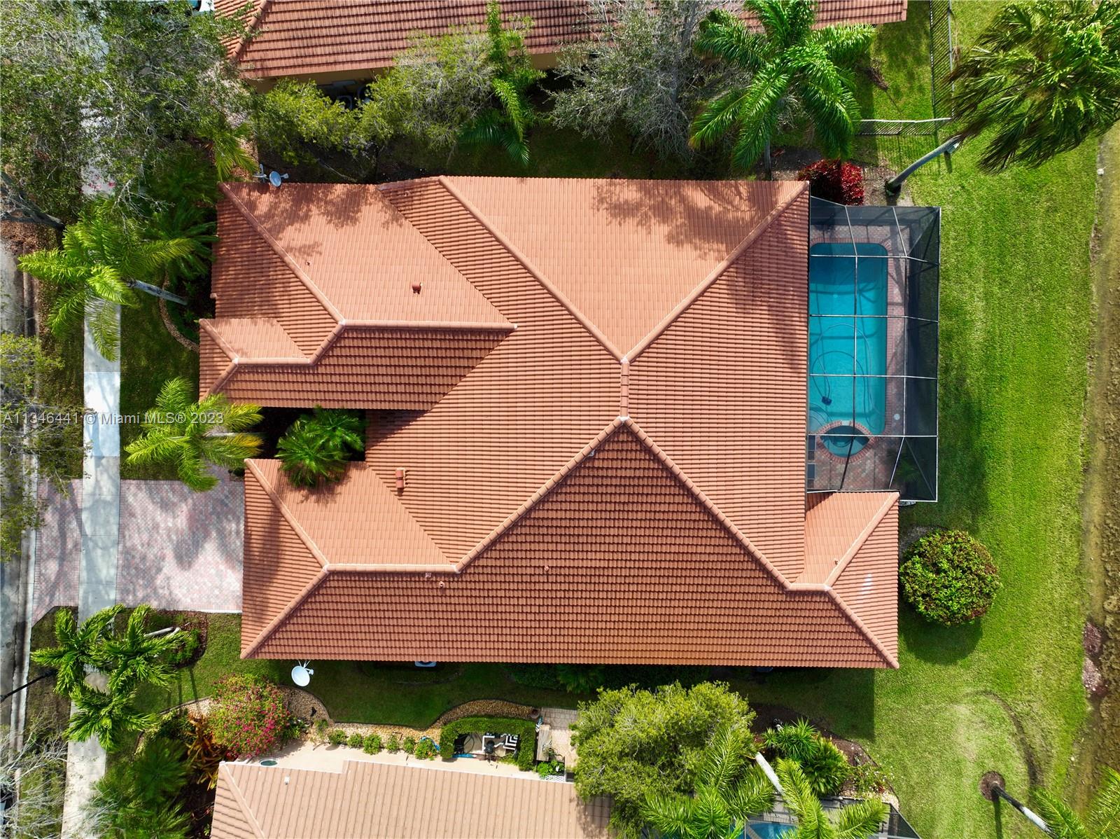 2883 Oakbrook Drive Weston, FL 33332 - Photo 63 of 74 a aerial view of a house with a yard and potted plants