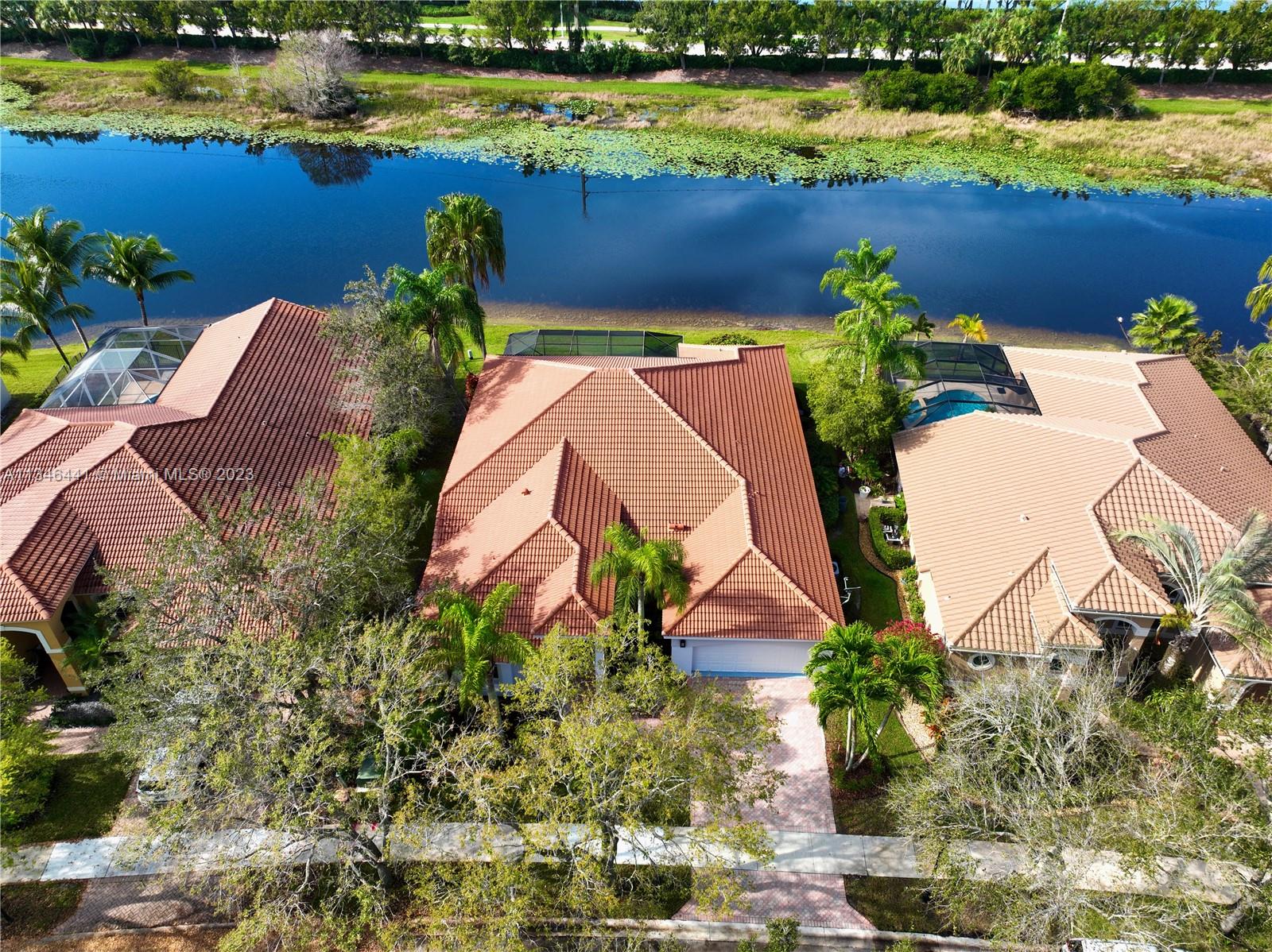 2883 Oakbrook Drive Weston, FL 33332 - Photo 68 of 74 an aerial view of a house with a lake view