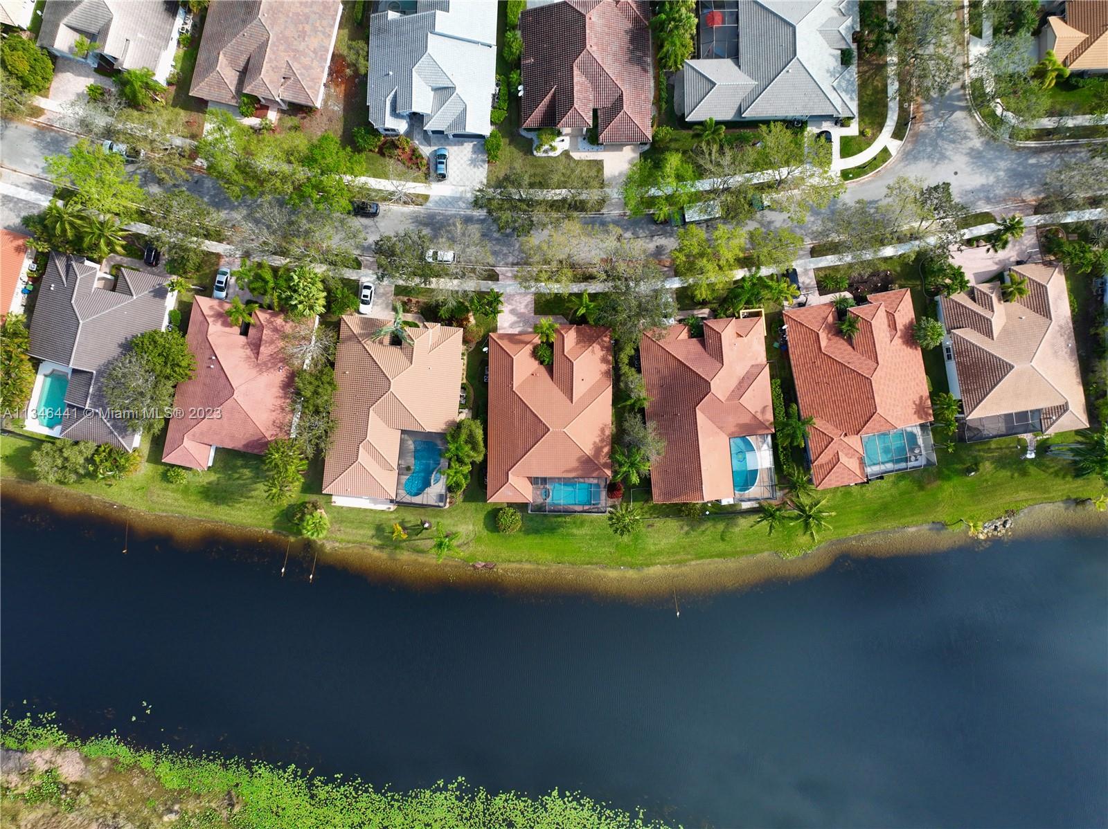 2883 Oakbrook Drive Weston, FL 33332 - Photo 70 of 74 an aerial view of residential house with outdoor space and parking