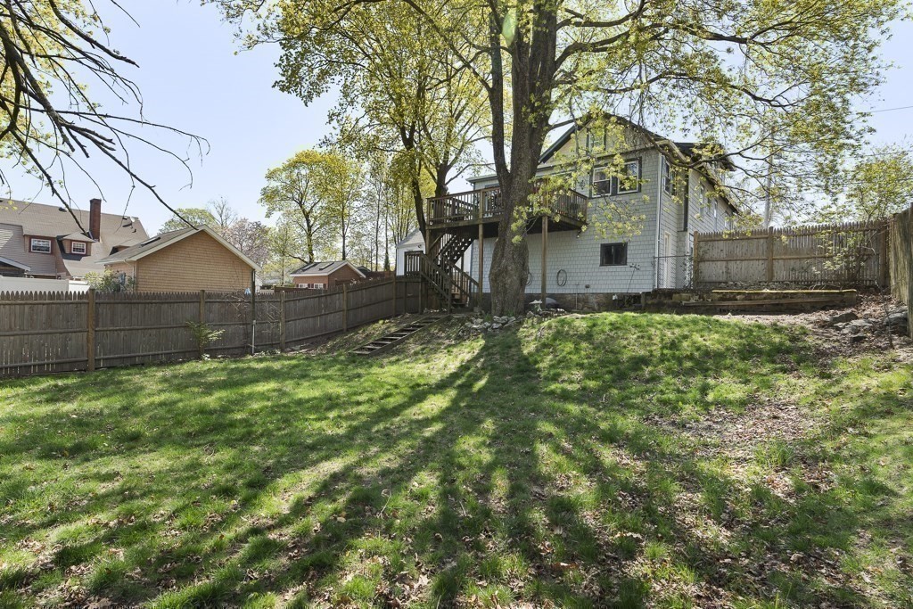 98 Summit Street Weymouth, MA 02188 - Photo 25 of 31 a backyard of a house with table and chairs